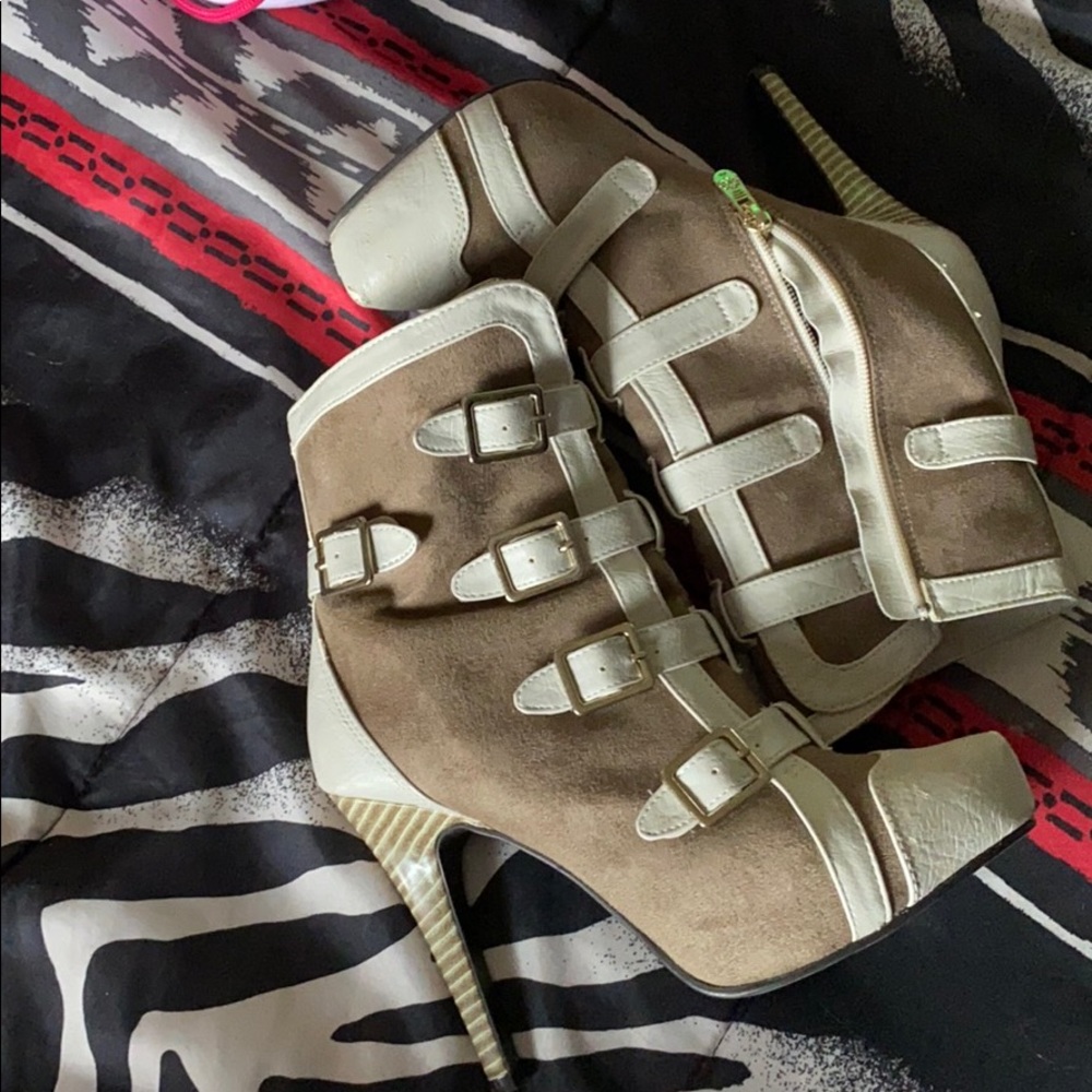 Tan and off white boots.